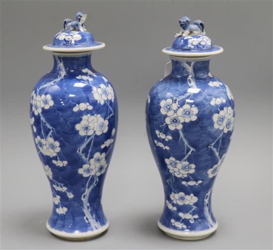 A pair of Chinese blue and white vases and covers, late 19th century height 31cm